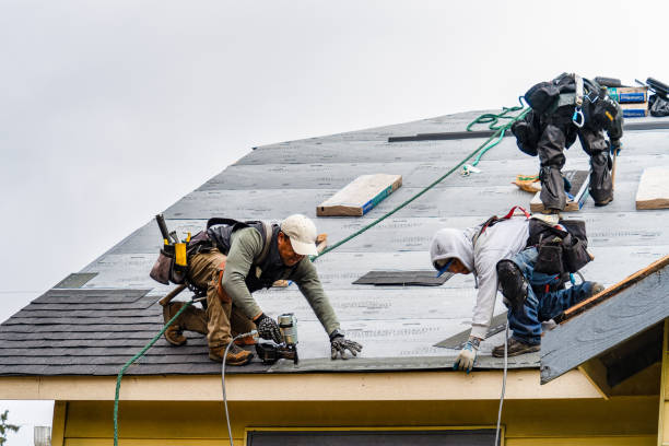 Professional Roofing technician working in Burlington, MA